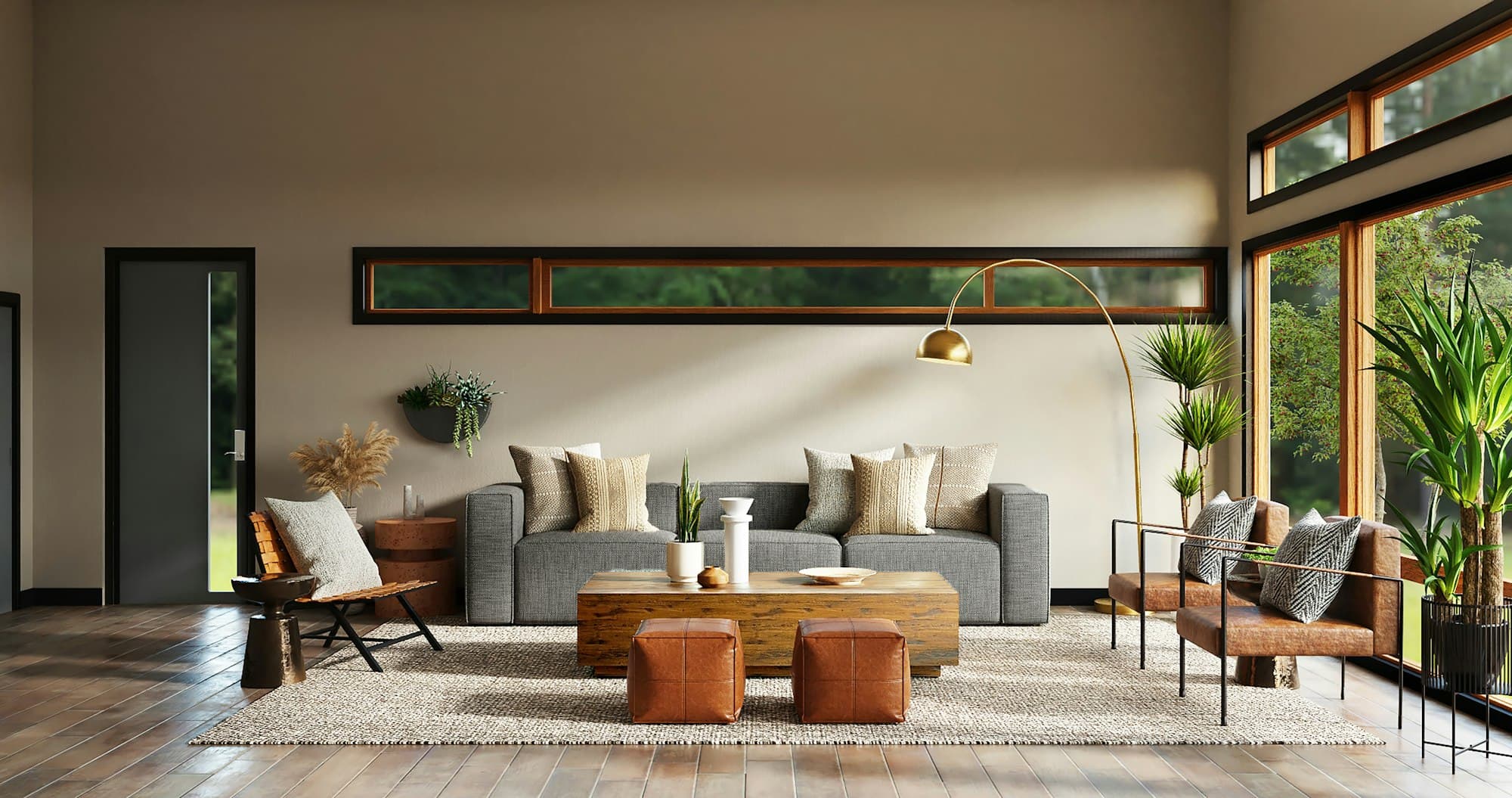 A freshly decorated open-plan living room with warm painted walls, large windows and considered styling.